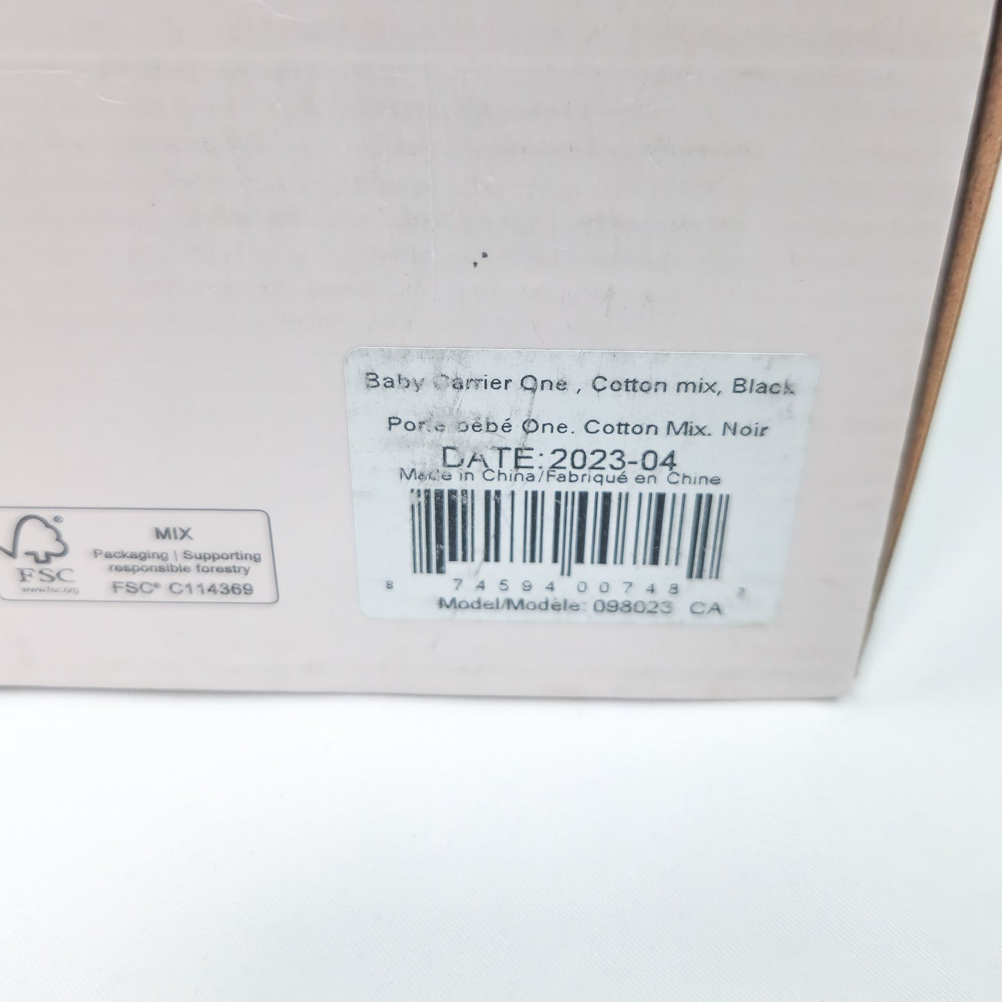 Packaging box for BABYBJÖRN Baby Carrier One in Black Cotton back side showing date of manufacture
