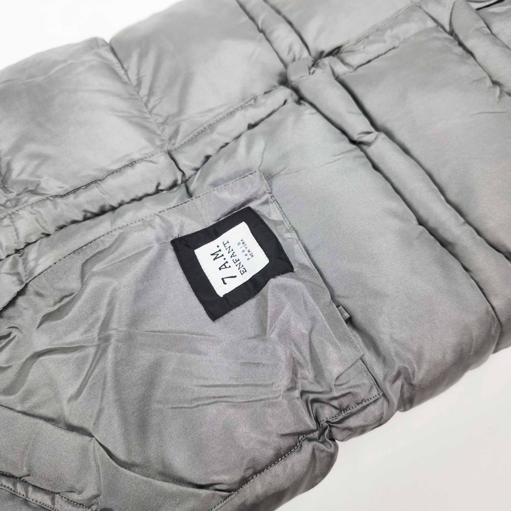 A metallic grey 7AM Enfant stroller blanket