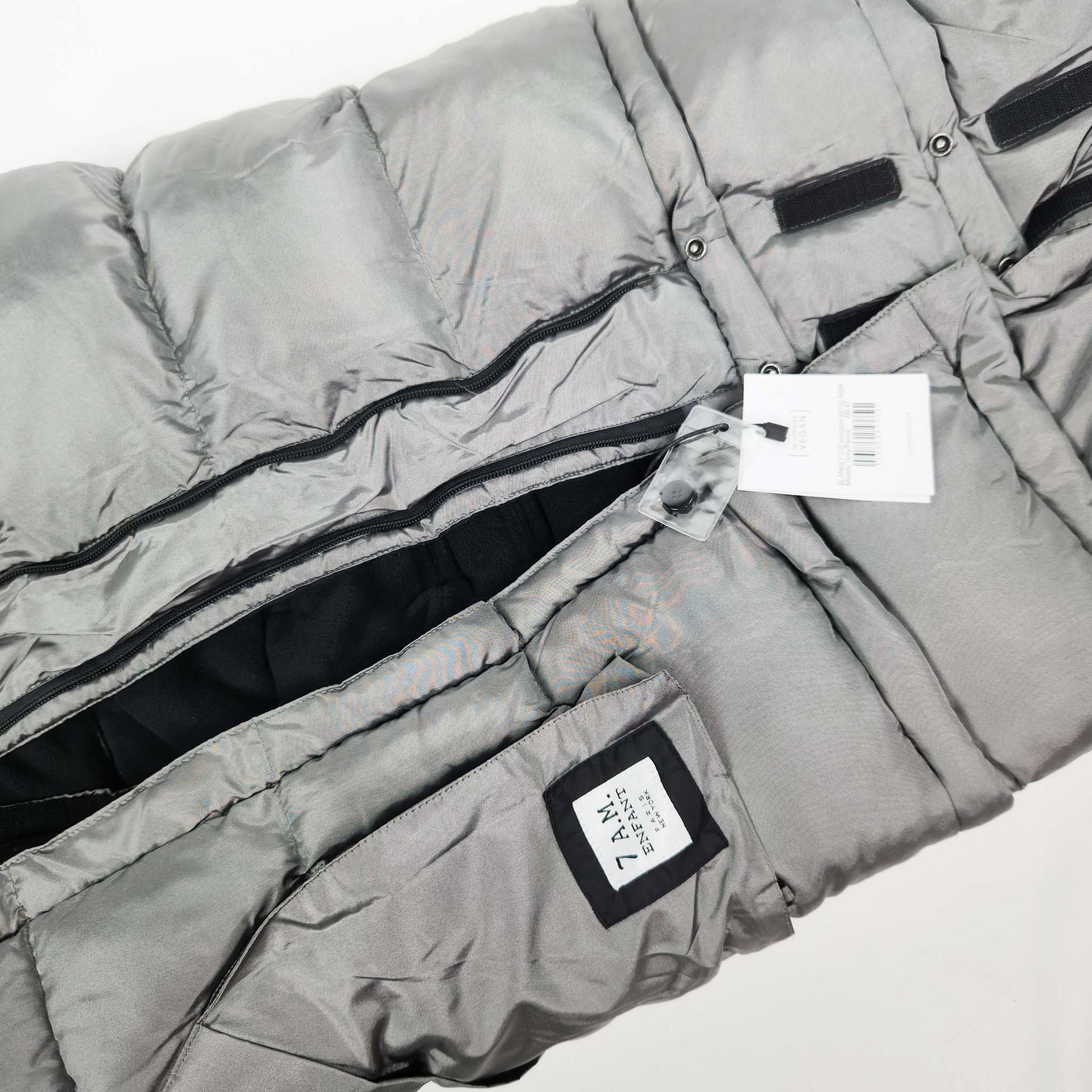 A metallic grey 7AM Enfant stroller blanket detail