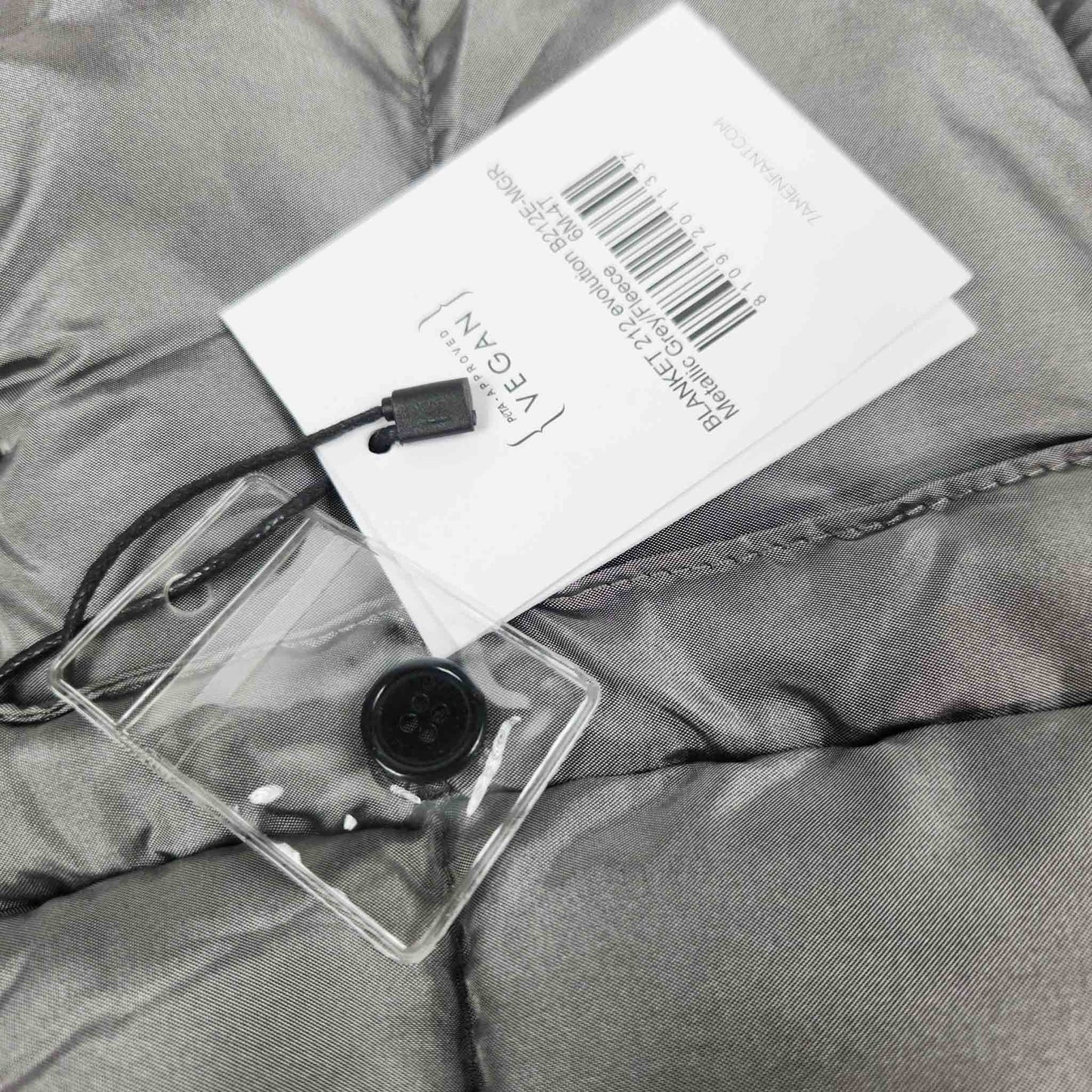 A metallic grey 7AM Enfant stroller blanket detail