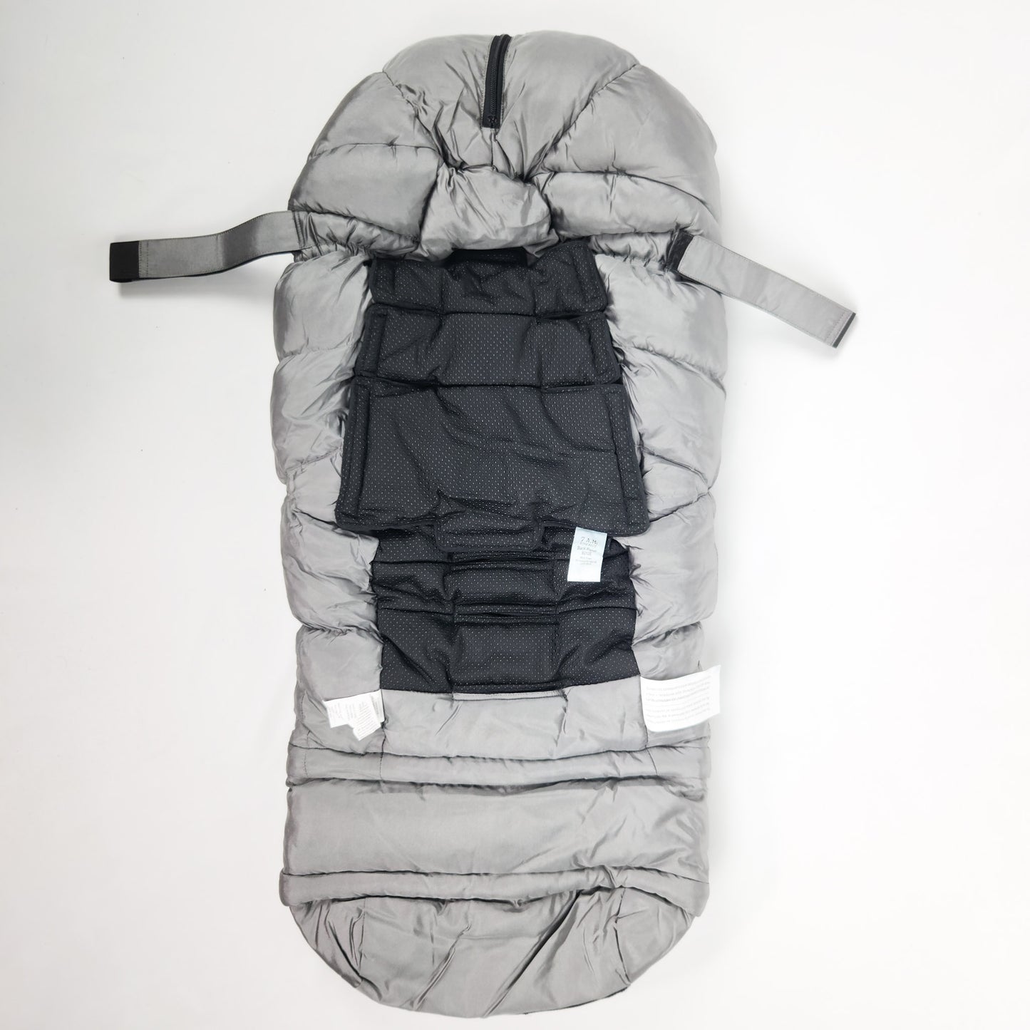 A metallic grey 7AM Enfant stroller blanket back