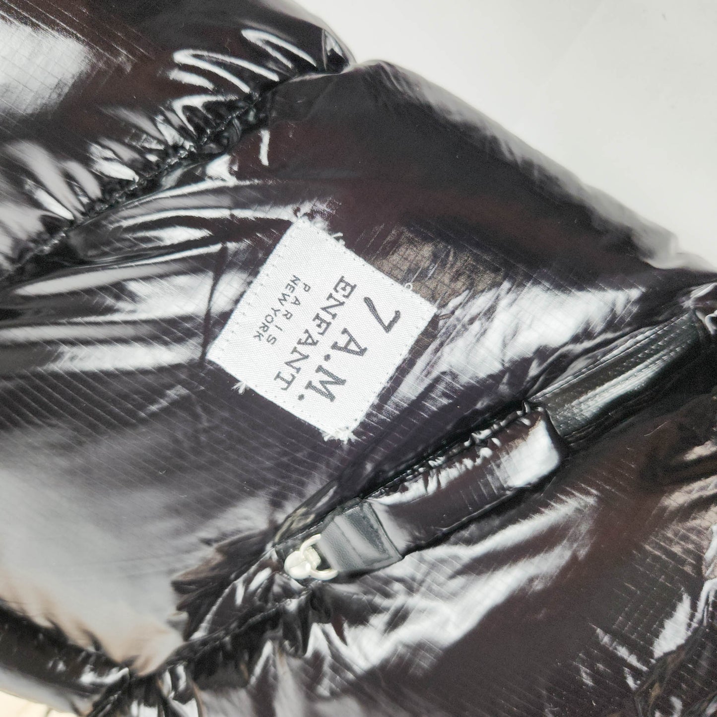 7AM Enfant Blanket 212 Evolution Black Polar footmuff with fleece lining close up view showing brand logo