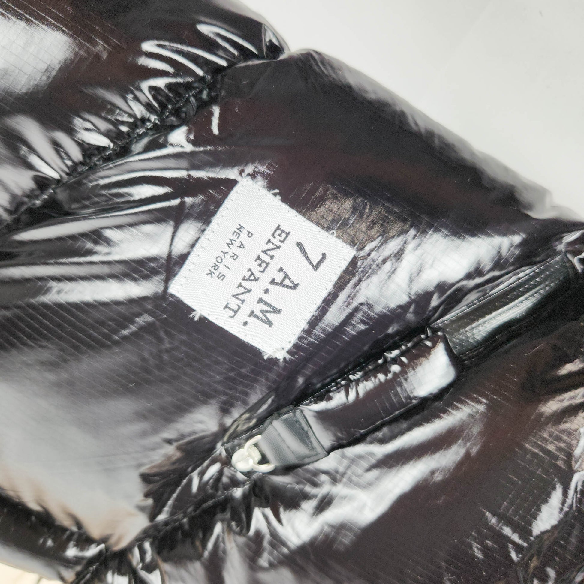 7AM Enfant Blanket 212 Evolution Black Polar footmuff with fleece lining close up view showing brand logo