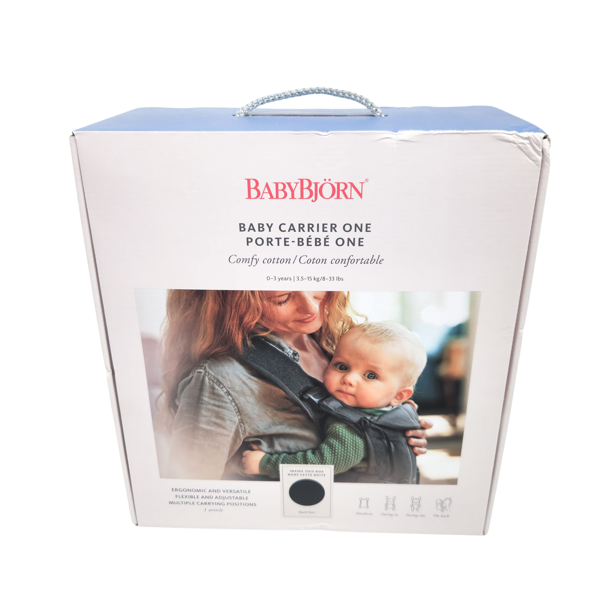 Packaging box for BABYBJÖRN Baby Carrier One in Black Cotton with image of a mother holding a baby and the carrier itself.