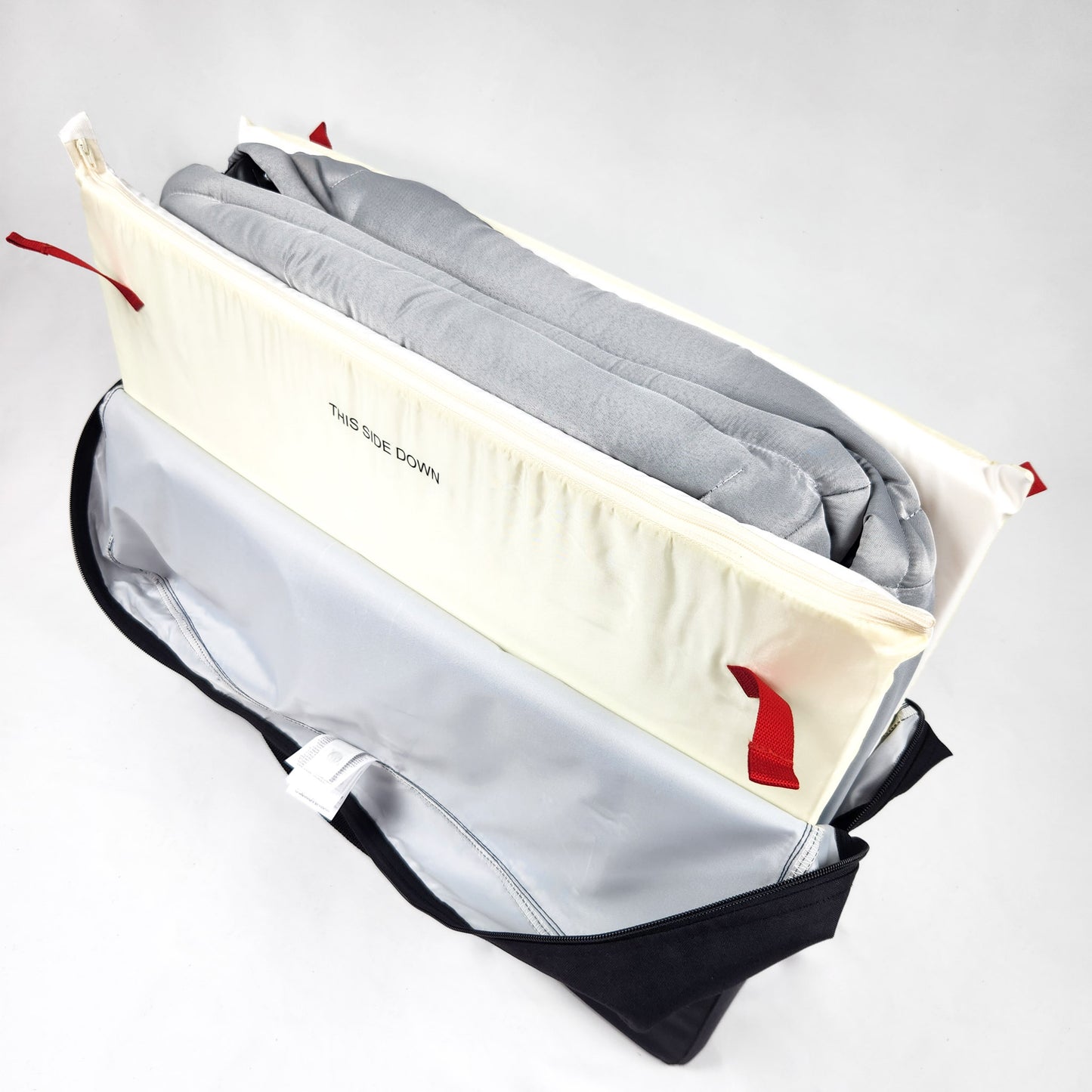 BABYBJÖRN Play Yard Light with Carry Bag - Silver folded inside the travel storage bag