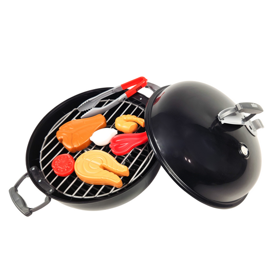 Weber Original Kettle Barbecue Toy in black with a removable lid, charcoal grate, and various play food items such as steak, salmon, shrimp, and vegetables, alongside grilling tools.