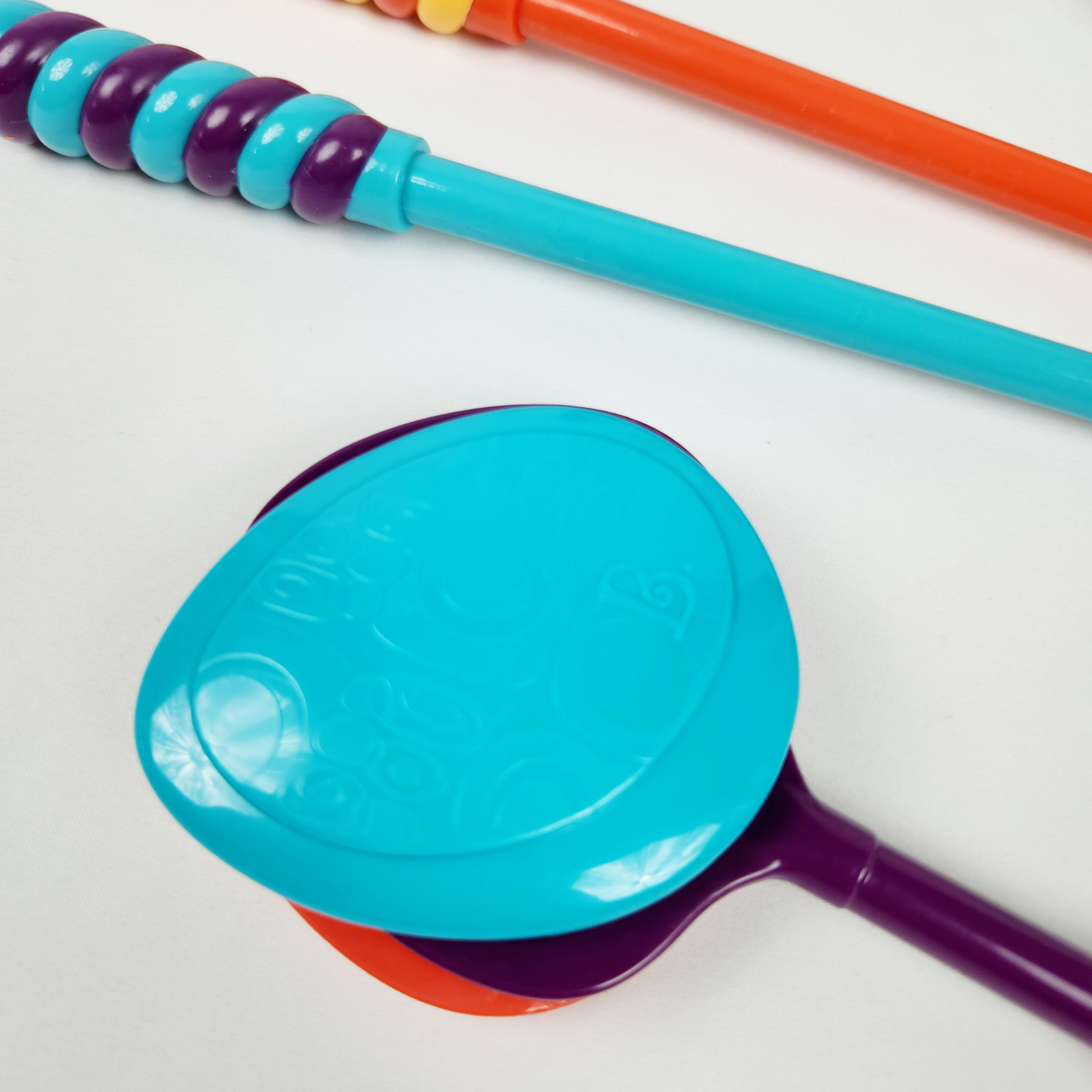 B Toys musical toy drum kit with instruments showing drum, strap and included instruments close up