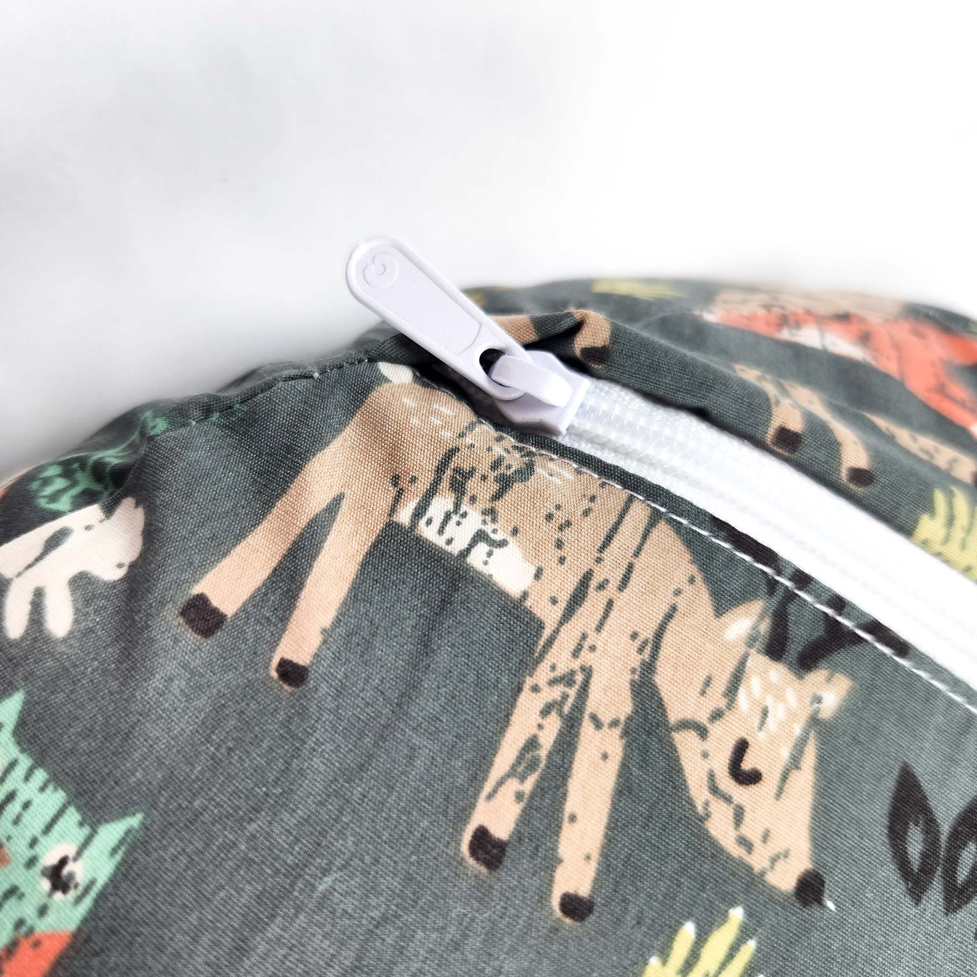 Boppy Original Nursing Pillow green forest animals breastfeeding support pillow close up showing zipper