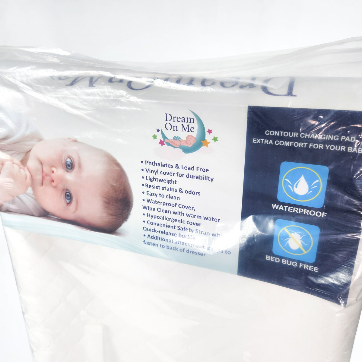 Dream On Me two sided contour changing pad in packaging showing waterproof pad and front close up view of the packaging