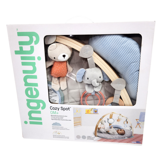 Ingenuity Cozy Spot reversible duvet activity gym in box showing play mat and hanging toys