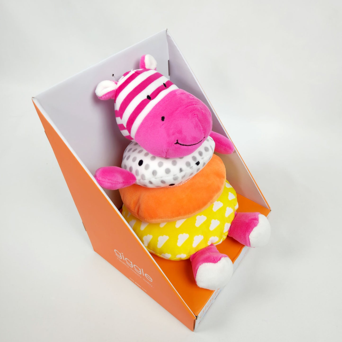 Giggle soft stacker baby toy pink hippo plush with colorful stacking rings in packaging