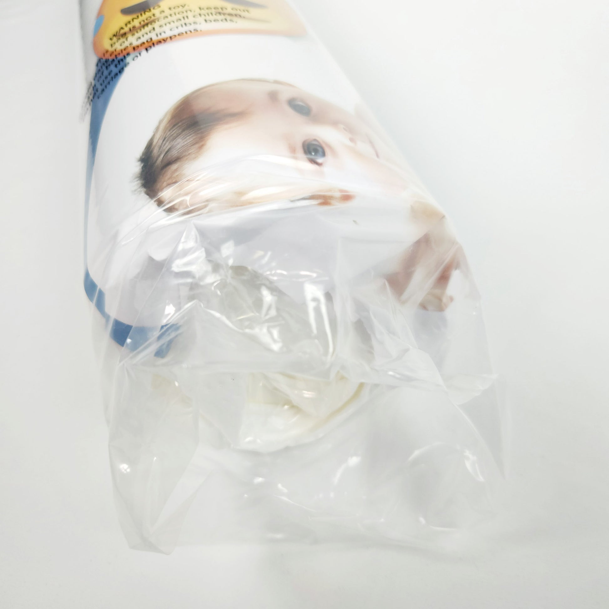 Milliard pack and play foam mattress topper rolled and sealed in packaging close up