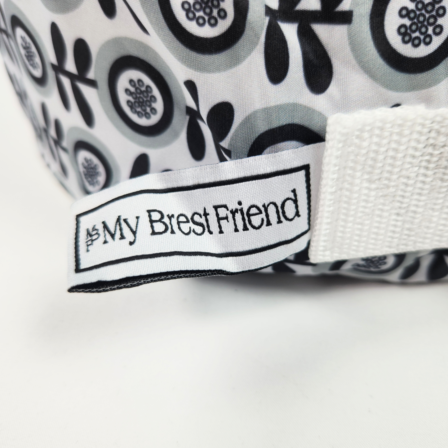 My Brest Friend Original Nursing Pillow Midnight Poppy wraparound breastfeeding support pillow close up showing brand label