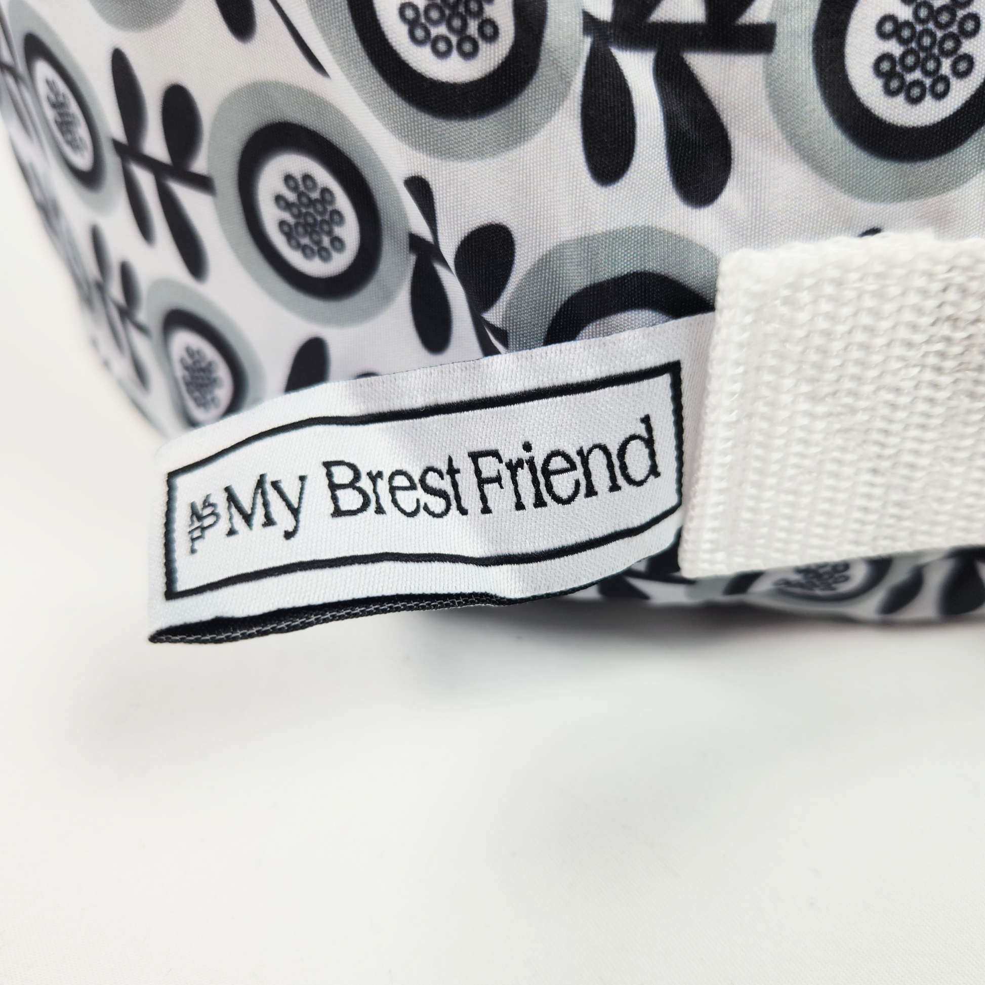 My Brest Friend Original Nursing Pillow Midnight Poppy wraparound breastfeeding support pillow close up showing brand label