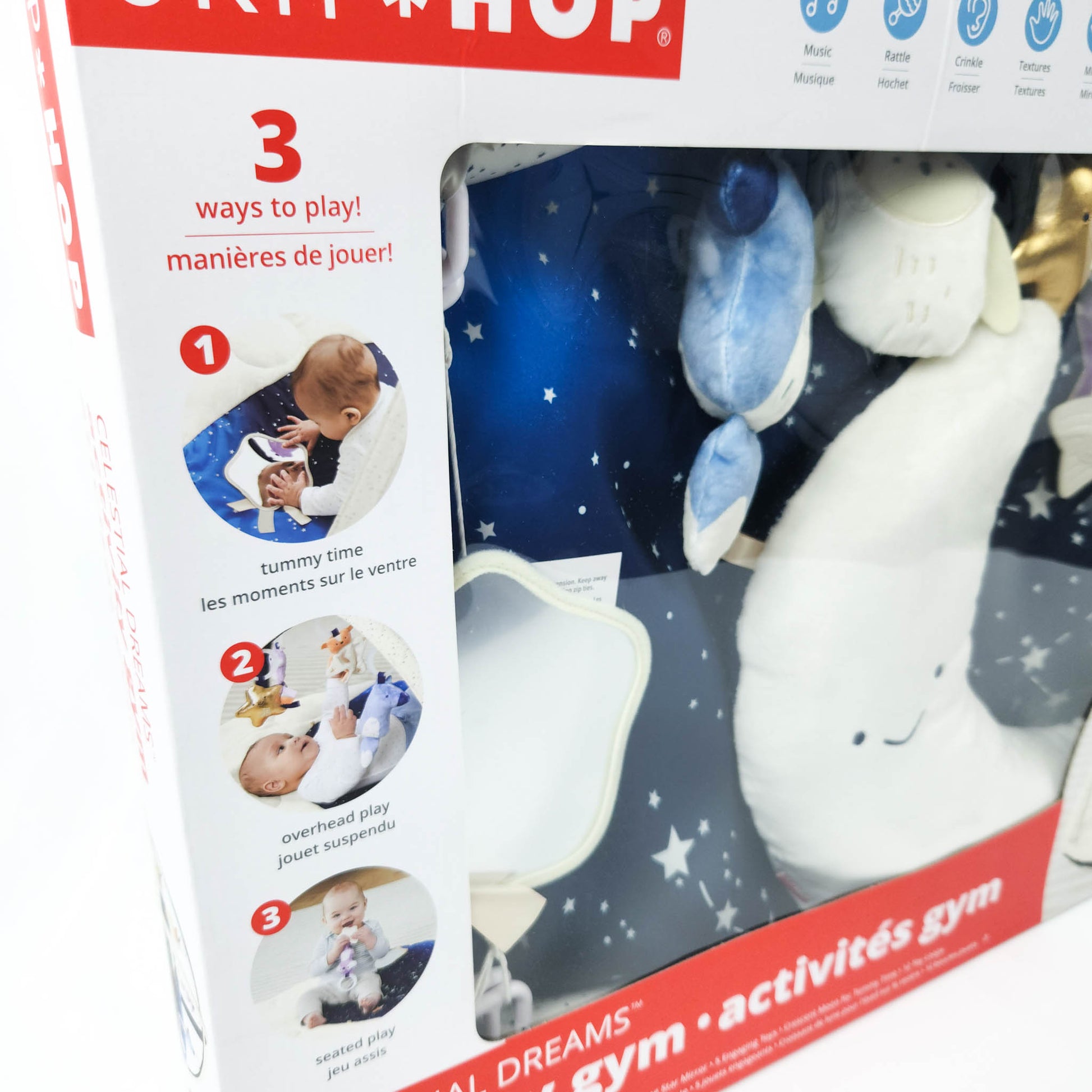 Skip Hop Celestial Dreams activity gym in box showing play mat and hanging toys front close up view