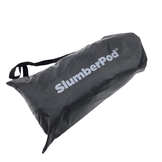 SlumberPod portable privacy pod blackout canopy crib cover bed tent in black, designed to create a private sleep space for baby and toddler travel use, showing in travel bag